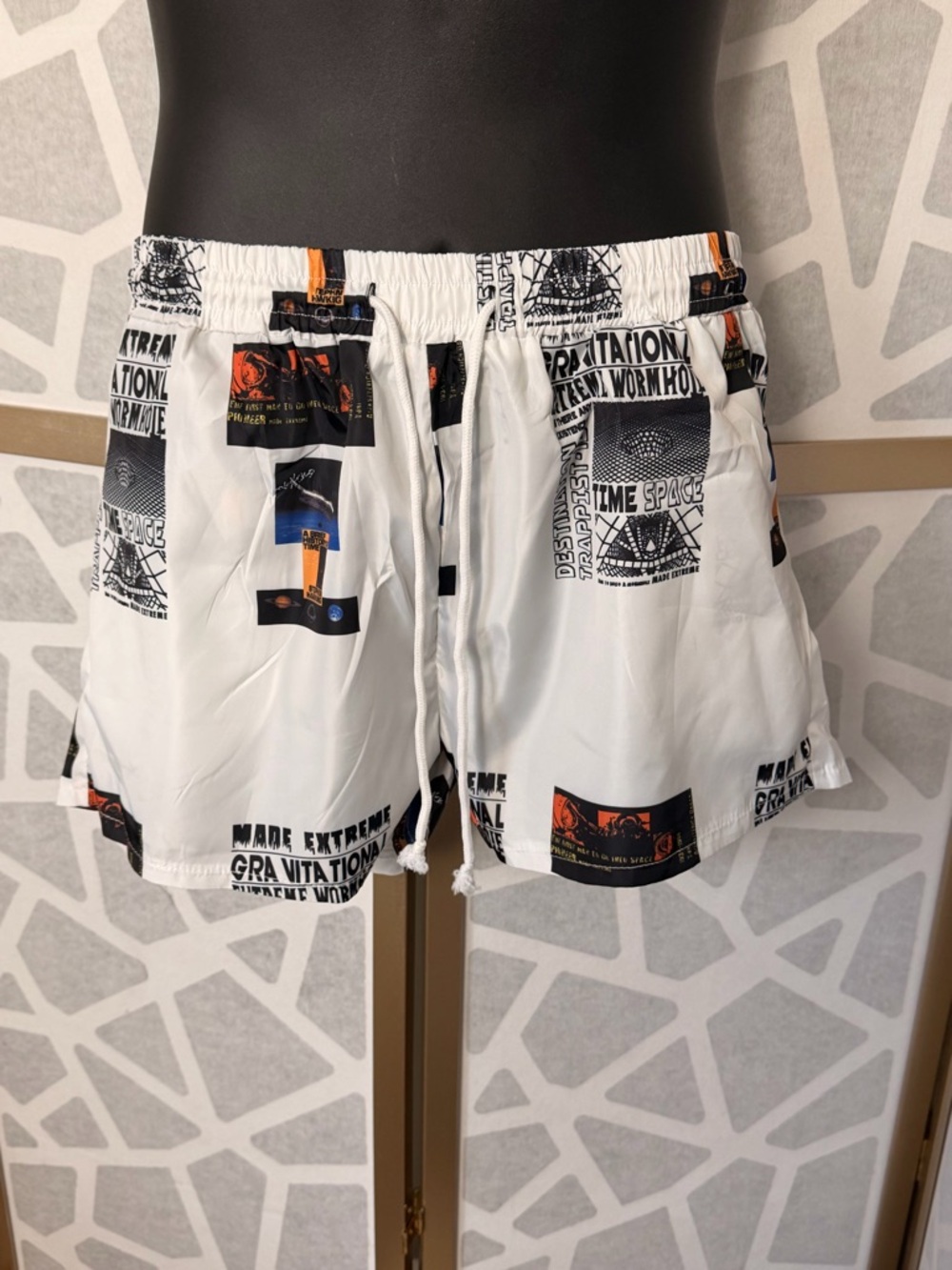 White Graphic Men's Swim Trunks with Black & Orange Accents